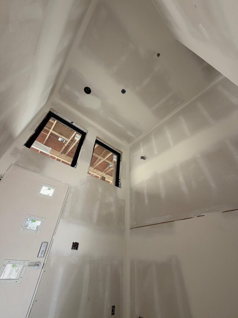 Vaulted drywall ceiling with skylights finished on Vancouver Island