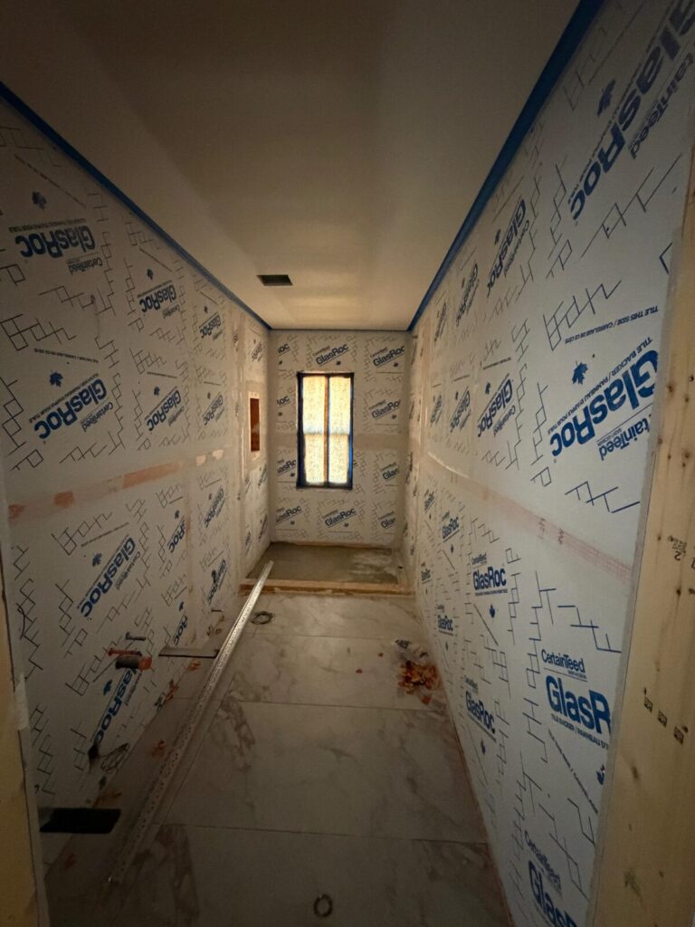 Sound-rated wall assembly with acoustic insulation before boarding, Nanaimo